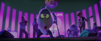 Movie still from “The Bad Guys” (2022), directed by Pierre Perifel – A cartoon character is holding a microphone and singing; Medium shot, Low angle