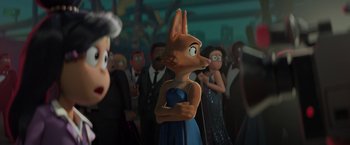 Movie still from “The Bad Guys” (2022), directed by Pierre Perifel – A group of people standing around a statue of a fox; Medium shot, Over the shoulder angle