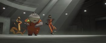 Movie still from “The Bad Guys” (2022), directed by Pierre Perifel – Two cartoon characters in orange jumpsuits in an arena; Wide shot, Low angle