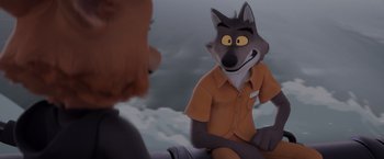 Movie still from “The Bad Guys” (2022), directed by Pierre Perifel – An animated wolf in an orange shirt is talking to a person; Medium shot, Over the shoulder angle