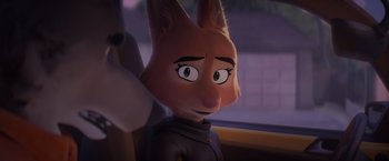 Movie still from “The Bad Guys” (2022), directed by Pierre Perifel – A character's face in a car; Close Up shot, Over the shoulder angle