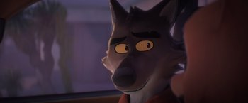 Movie still from “The Bad Guys” (2022), directed by Pierre Perifel – The face of a cartoon wolf; Close Up shot, Over the shoulder angle