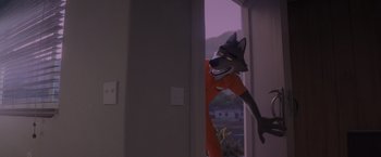 Movie still from “The Bad Guys” (2022), directed by Pierre Perifel – A man with a wolf mask is standing in a doorway; Wide shot, High angle