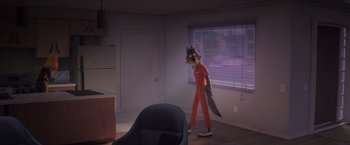 Movie still from “The Bad Guys” (2022), directed by Pierre Perifel – An animated character in an orange suit in a room; Wide shot, High angle