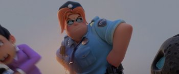 Movie still from “The Bad Guys” (2022), directed by Pierre Perifel – An animated police officer in a blue uniform; Medium shot, Low angle