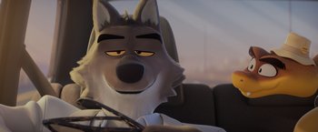 Movie still from “The Bad Guys” (2022), directed by Pierre Perifel – A cartoon wolf sitting in the driver's seat of a car; Close Up shot, Over the shoulder angle