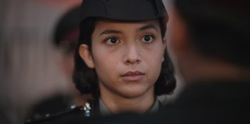 Movie still from “The Big 4” (2022), directed by Timo Tjahjanto – A person wearing a uniform; Close Up shot, Low angle