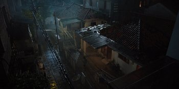 Movie still from “The Big 4” (2022), directed by Timo Tjahjanto – An aerial view of a city street at night; Extreme Wide shot, High angle