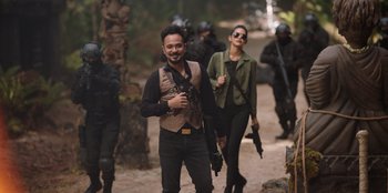 Movie still from “The Big 4” (2022), directed by Timo Tjahjanto – A group of people with guns in the woods; Medium shot, Low angle