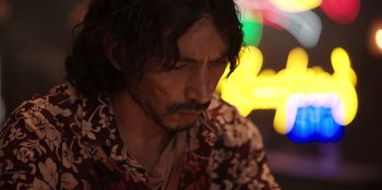 Movie still from “The Big 4” (2022), directed by Timo Tjahjanto – A person with long hair; Close Up shot, Low angle