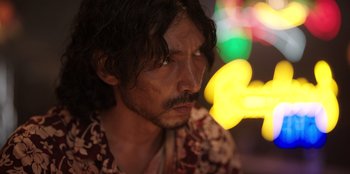 Movie still from “The Big 4” (2022), directed by Timo Tjahjanto – A person with long black hair; Close Up shot, Low angle