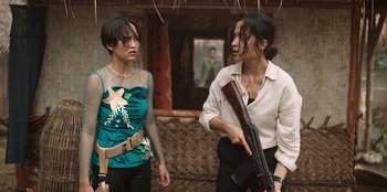 Movie still from “The Big 4” (2022), directed by Timo Tjahjanto – Two asian women standing next to each other; Medium shot, Over the shoulder angle