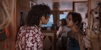 Movie still from “The Big 4” (2022), directed by Timo Tjahjanto – A man and a woman face to face in a room; Medium shot, Over the shoulder angle