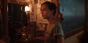 Movie still from “The Big 4” (2022), directed by Timo Tjahjanto – A young woman is looking at the camera; Medium shot, Low angle