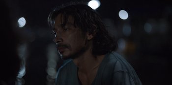 Movie still from “The Big 4” (2022), directed by Timo Tjahjanto – A person with long black hair; Close Up shot, Over the shoulder angle