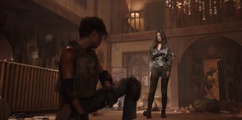 Movie still from “The Big 4” (2022), directed by Timo Tjahjanto – A man and a woman are standing in an abandoned building; Wide shot, Low angle