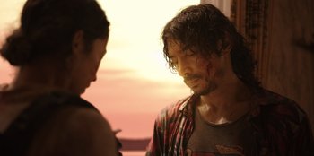 Movie still from “The Big 4” (2022), directed by Timo Tjahjanto – A man and a woman standing next to each other in front of a sunset; Close Up shot, Over the shoulder angle