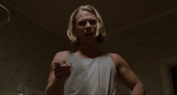 Movie still from “The Big Lebowski” (1998), directed by Ethan Coen – A man with blonde hair is pointing at the camera; Medium shot, Low angle