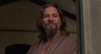 Movie still from “The Big Lebowski” (1998), directed by Ethan Coen – A person with long hair and a beard; Close Up shot, Low angle
