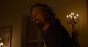 Movie still from “The Big Lebowski” (1998), directed by Ethan Coen – A man with long hair and a long beard; Medium shot, Over the shoulder angle
