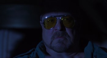 Movie still from “The Big Lebowski” (1998), directed by Ethan Coen – A person wearing sunglasses; Close Up shot, Low angle