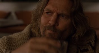 Movie still from “The Big Lebowski” (1998), directed by Ethan Coen – A person with long hair and a beard; Close Up shot, Low angle