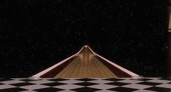 Movie still from “The Big Lebowski” (1998), directed by Ethan Coen – An empty bowling alley at night with a checkerboard floor; Extreme Wide shot, Overhead angle