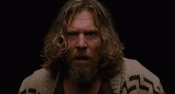 Movie still from “The Big Lebowski” (1998), directed by Ethan Coen – A person with long hair and a beard; Close Up shot, Low angle