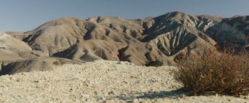 Movie still from “The Biggest Little Farm: The Return” (2022), directed by John Chester – A view of a mountain range from the ground; Extreme Wide shot, Low angle