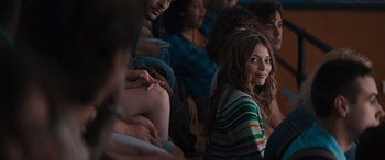 Movie still from “The Binge” (2020), directed by Jeremy Garelick – A group of young people sitting in a room together; Medium shot, Over the shoulder angle