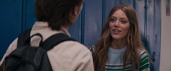 Movie still from “The Binge” (2020), directed by Jeremy Garelick – A woman standing in front of a mirror talking to a man; Close Up shot, Over the shoulder angle