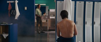 Movie still from “The Binge” (2020), directed by Jeremy Garelick – A man standing in front of a woman in a bathroom; Medium shot, Over the shoulder angle