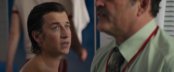 Movie still from “The Binge” (2020), directed by Jeremy Garelick – A young man and an older man are talking to each other; Close Up shot, Over the shoulder angle