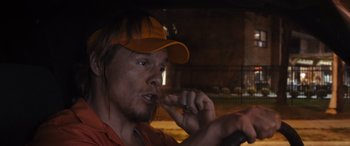 Movie still from “The Binge” (2020), directed by Jeremy Garelick – A man in an orange hat is brushing his teeth; Close Up shot, High angle
