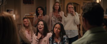 Movie still from “The Binge” (2020), directed by Jeremy Garelick – A group of women standing next to each other drinking wine; Medium shot, High angle
