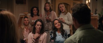 Movie still from “The Binge” (2020), directed by Jeremy Garelick – A group of women standing next to each other holding wine glasses; Medium shot, Over the shoulder angle