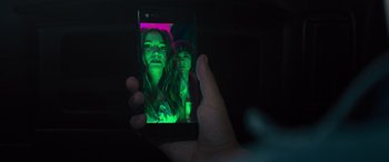 Movie still from “The Binge” (2020), directed by Jeremy Garelick – A person taking a picture with a cell phone; Extreme Close Up shot, High angle