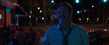 Movie still from “The Binge” (2020), directed by Jeremy Garelick – A man in a blue shirt and a blue tie; Close Up shot, Over the shoulder angle