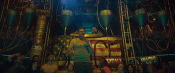 Movie still from “The Binge” (2020), directed by Jeremy Garelick – A group of people standing in front of an american flag; Medium shot, Low angle