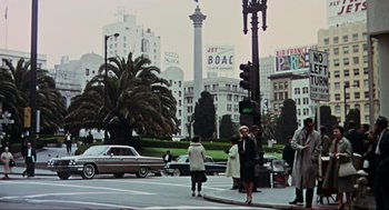 Movie still from “The Birds” (1963), directed by Alfred Hitchcock – A group of people standing on the side of a road; Extreme Wide shot, Low angle