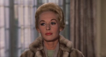 Movie still from “The Birds” (1963), directed by Alfred Hitchcock – A person wearing a fur coat; Close Up shot, Low angle