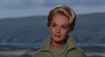 Movie still from “The Birds” (1963), directed by Alfred Hitchcock – A person wearing a green jacket; Close Up shot, Low angle