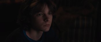 Movie still from “The Black Phone” (2021), directed by Scott Derrickson – A young man is looking into the camera; Close Up shot, High angle