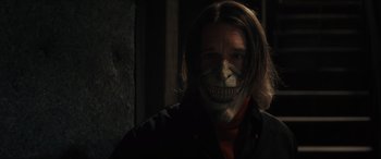 Movie still from “The Black Phone” (2021), directed by Scott Derrickson – A man with a skull mask on his face; Close Up shot, Low angle