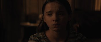 Movie still from “The Black Phone” (2021), directed by Scott Derrickson – A young girl is looking at the camera; Close Up shot, High angle