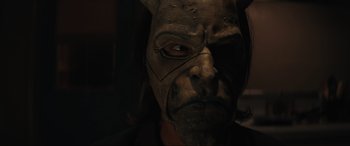 Movie still from “The Black Phone” (2021), directed by Scott Derrickson – The face of a person wearing a mask; Close Up shot, Low angle