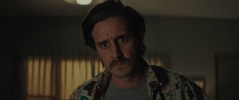 Movie still from “The Black Phone” (2021), directed by Scott Derrickson – A person with a beard and mustache; Close Up shot, Low angle