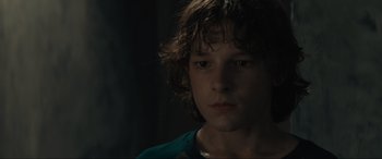 Movie still from “The Black Phone” (2021), directed by Scott Derrickson – A person with long brown hair; Close Up shot, Low angle