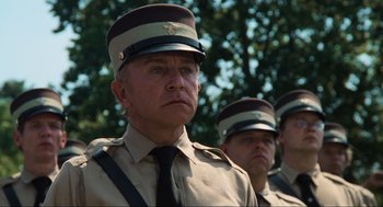 Movie still from “The Blues Brothers” (1980), directed by John Landis – A group of men standing next to each other wearing hats; Close Up shot, Low angle