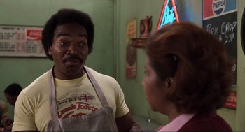 Movie still from “The Blues Brothers” (1980), directed by John Landis – A man and a woman are looking at each other in the mirror; Medium shot, Low angle